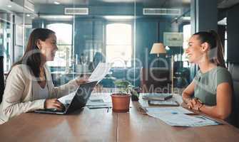 Job interview for a business woman at a hiring company talking to the HR manager about the role or position. Young female applicant or candidate in a meeting with an employer having a discussion