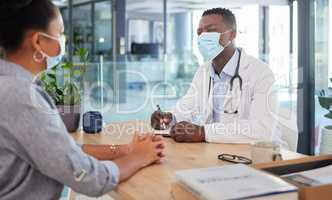 Covid doctor talking to patient for a medical checkup, wellness consult and healthcare screening in a clinic. Trusted gp, physician and essential worker discussing medicine and consulting health