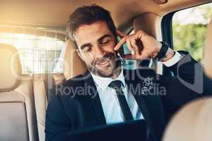 Hes hearing good news on hes way to the office. a handsome young corporate businessman on a call while commuting.