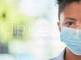 Humanity, care and protection person in covid mask with half face pose on bokeh or blurred healthcare background. Hygiene woman covering face to stop the spread of virus or disease