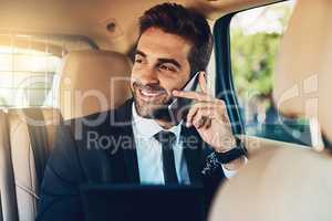 Thats great news, Ill be there shortly. a handsome young corporate businessman on a call while commuting.