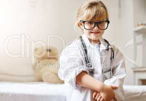 One day Ill save lives just like mommy does. Portrait of an adorable little girl dressed up as a doctor.