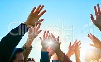 The hands of victory. a group of unrecognizable peoples hands outside.