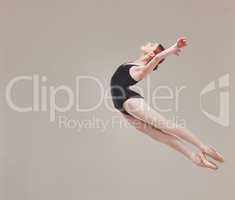 Ballet dancer dancing, training and artistically jumping in the air with flexibility, fitness and performance. Healthy, motion and talented ballerina exercises for a classical act in studio