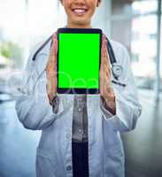 Check out this site for the latest in medical news. Portrait of a young female doctor holding a digital tablet with a chroma key screen.