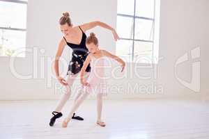 Ballet, elegance and dancing instructor teaching a little ballerina movement and posture at a dance studio. Teacher bonding with a child while learning performance routine and grace, classical art