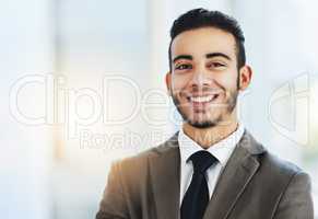 Set each day as a chance to achieve greatness. Portrait of a confident young businessman standing in an office.