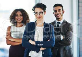 Youre looking at the top leaders in the industry. Portrait of a diverse team of professionals standing together in an office.