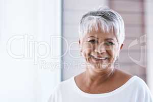 Life gets better and better with age. Portrait of a cheerful mature woman with a bright smile looking at the camera.