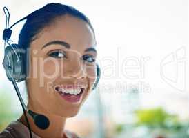 How may I direct your call. a young woman working in a call center.