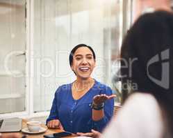 What are your views on the subject. a cheerful young creative businesswoman having a discussion with coworkers at a meeting around a table in a coffeeshop.