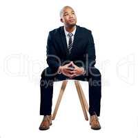 Hes following the professional path. Studio shot of a handsome young businessman posing against a white background.