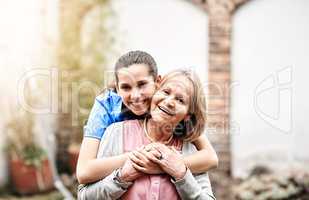 Our relationship grew pass patient and caretaker. Portrait of a senior patient outside with her caregiver.