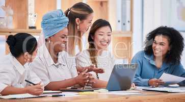 Multicultural females only talking and planning business strategy and growth together in a meeting at the office. A happy marketing team of women collaborating on a project and working on a proposal