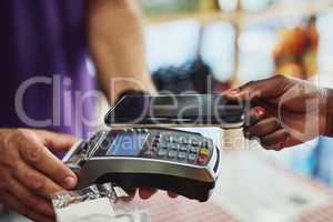 Theres no easier way to pay. an unrecognizable customer making payment in a store.