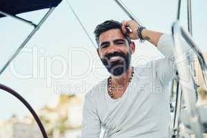 Breathing happy air. a handsome mature man on his yacht.