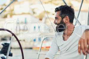 Theres only one way to enjoy panoramic views. a handsome mature man on his yacht.