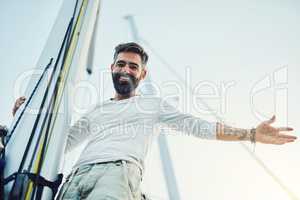 Home is where the anchor drops. a handsome mature man on his yacht.