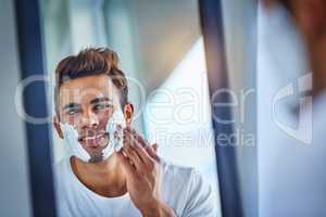 Because whiskers are for cats. a handsome young man shaving his facial hair in the bathroom.