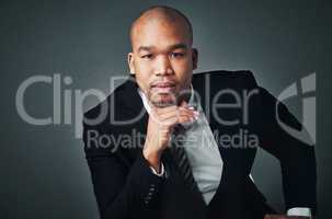 Put effort in you and who you want to be. Studio shot of a handsome young businessman posing against a gray background.