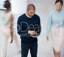 Busy office with business man on tablet browsing, planning and scrolling for online research, mobile notes and digital ideas from above. Organized entrepreneur working on plan in a bustling workplace