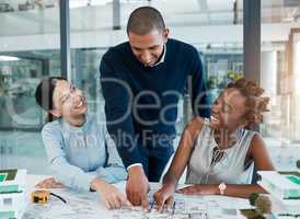 Blueprints, building engineers and architects pointing, showing and smiling in meeting to plan renovation or remodel. Diverse group of designers agreeing and choosing structure design or vision ideas