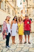 Sight seeing with the best people in my life. Full length portrait of a family of four travelling in a foreign city.