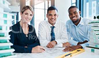 Industrial design, development and diverse engineers working on an innovative project as a team. Portrait of multiracial, expert and professional industry workers analyzing a construction drawing.