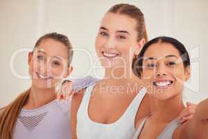 Fun, diverse and sporty friends selfie after routine workout, exercise or training in yoga class or pilates studio. Portrait of smiling, happy or cheerful women bonding, having fun and standing close