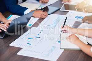 Planning target, marketing goal and business meeting with people looking at budget report, charts and graphs on laptop in a boardroom meeting. Corporate company workers in sales and budget discussion