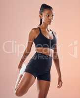 Fit, strong and active young athlete stretching legs for warmup, performance and to prepare for exercise, workout and training against a colorful studio background. Healthy, toned and beautiful woman
