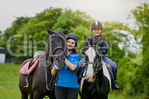 Horses leave hoofprints on your heart. young girls with their horses outdoors.