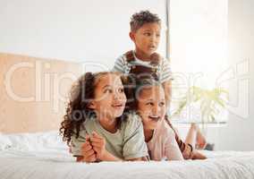 Happy children or siblings relaxing, playing and enjoying the house, growth and freedom. Kids, bedroom and facial expressions while watching entertainment shows on the bed together at home.