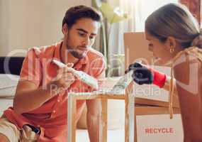 Couple painting or decorate wooden table or chair by recycle and thrift furniture for a home improvement project in apartment. Creative and DIY man and woman with reusable objects in their house