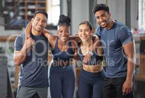 Fitness, exercise and diverse accountability group standing together and looking happy after training at gym. Portrait of friends enjoying their membership at a health and wellness facility