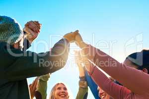 Lets get together and celebrate our diversity. a group of young students enjoying the day outside together.