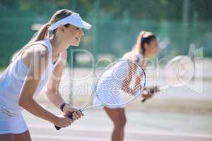 Fun women playing tennis match, practicing for competition and getting ready for sporty fitness game on a court outside, Female friends and teammates doing cardio training and sports workout together