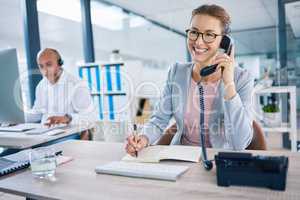 Smiling receptionist, business woman or customer service employee consulting on phone in telemarketing call center office. Happy corporate or crm support manager working in contact us helpdesk