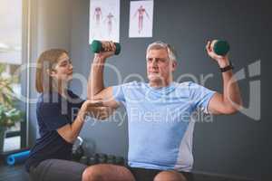 Keeping his strength up. a female physician working with a senior male patient.