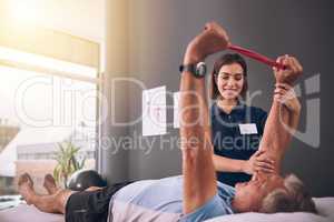 Im impressed. a young female physiotherapist treating a mature male patient.