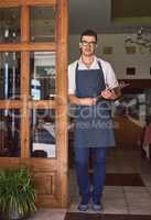 This is the place to be for great food. a man working at a restaurant.