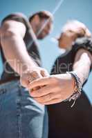 Engaged couple celebrating romantic marriage proposal with engagement ring on hand from below outside. Love, bonding and romance for special occasion, devotion and commitment in relationship together