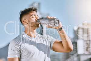 Fitness, healthy thirsty man drinking water while he is exercising outside in sportswear. Runner, cardio workout and active lifestyle for strong athletic body or mental discipline.