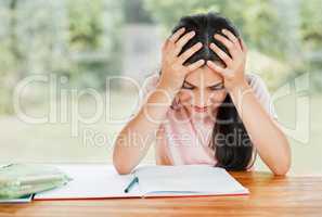 Stress, anxiety and overwhelmed with a little girl struggling with her studies, education and learning at home. Confused, frustrated and tired student having trouble with homework and study material