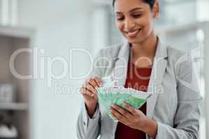 Financial growth, retirement saving and holding money notes by a young female with cash indoors. Bank notes showing growing investment, banking capital and finance budget of a happy woman accountant
