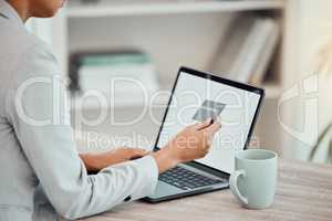 Business woman, finance advisor and accountant shopping online with blank laptop and credit card in an office. Closeup of trader paying, budget and spending money with banking transfer for ecommerce