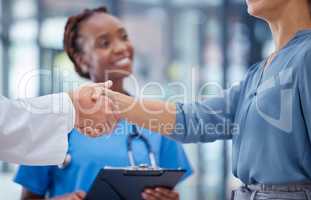 Doctors handshake thank you, greeting or good medical breakthrough success with smiling nurse in background. Physician, healthcare worker and patient shaking hands for innovation in health research