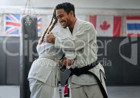 . Karate trainer giving hug to female student for motivation, coach embracing for support and celebration after winning competition. Teammates and friends training and learning martial arts at a gym.