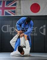 Martial arts, karate or judo fighters and athletes fighting in a competition, match or tournament. Japan vs UK, self defense and protection professionals with skill fight in a dojo to win and compete
