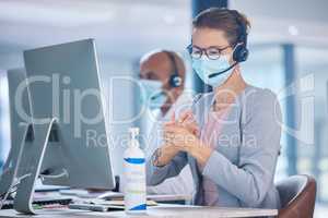 Covid, hand sanitizer and call center agent with mask cleaning hands, protecting or staying safe in customer support office. Receptionist, advisor or operator with computer preventing spread of virus